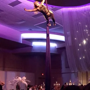 Aerialist Kat Boston of Rebel Aerial flying for the Glow Gala