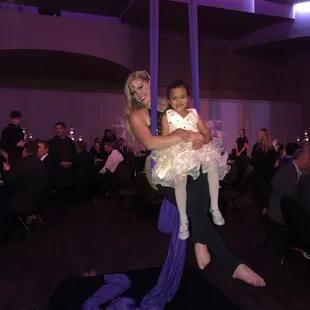 Aerialist Kat Boston of Rebel Aerial flying for the Glow Gala