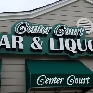 the front of a bar and liquor store