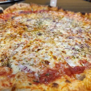 An off menu specialty pizza, with no mushrooms. Cheese, onion, basil and olive oil.