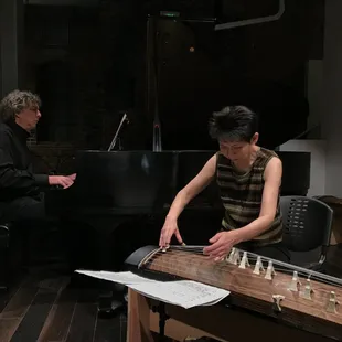 a woman playing a musical instrument