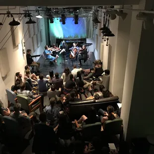 a group of people sitting in a room