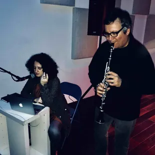 a man and a woman playing instruments