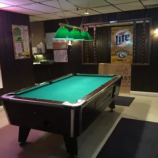a pool table in a bar
