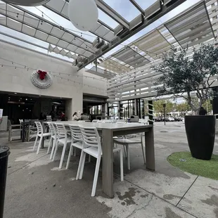 tables and chairs under a canopy