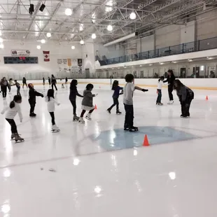 Kids taking their ice skating lessons on a Friday night!