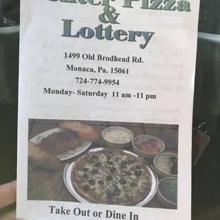 a hand holding up a sign