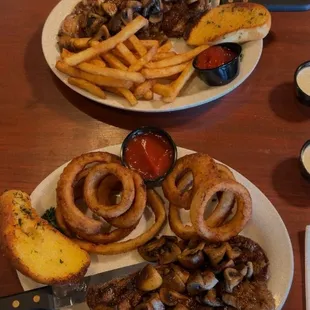 New York Steak with onion rings and rib eye steak with French fries