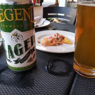 a beer and a slice of pizza