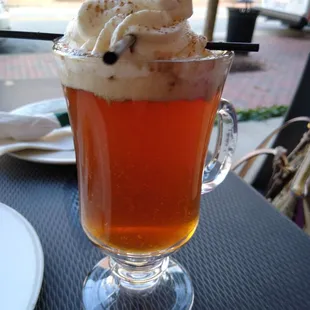 a cup of iced coffee with whipped cream