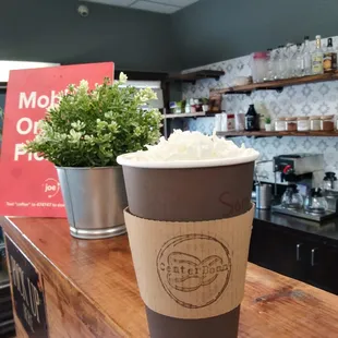 a cup of coffee on a counter