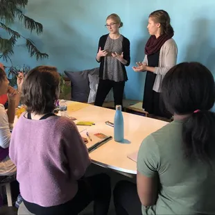 An intern and her classmate from the Dietitics program at the university give a nutrition talk in our community space.