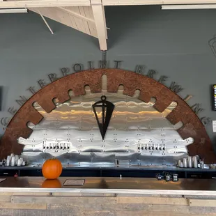 the bar counter with a clock on the wall