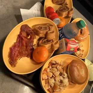a variety of breakfast foods on a tray
