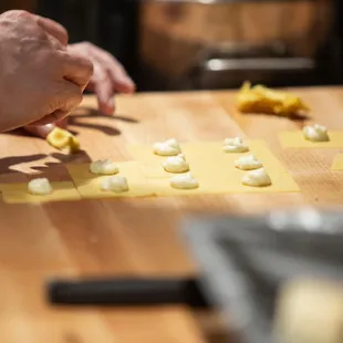 a person preparing food on a cutting board