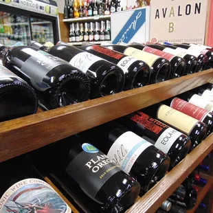 a shelf of wine bottles