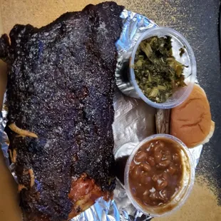 Completely Burned And Dry Half Rack Of Ribs With Two Tiny Sides.