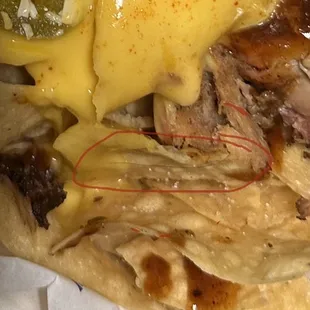 Hair wrapped around the chip and covered in cheese