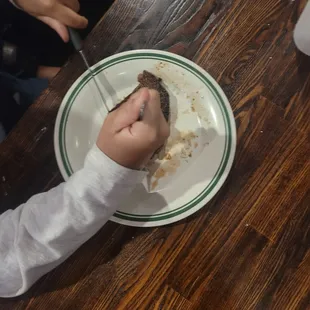 We're working on his knife skills. He said his 2nd steak was a perfect med rare