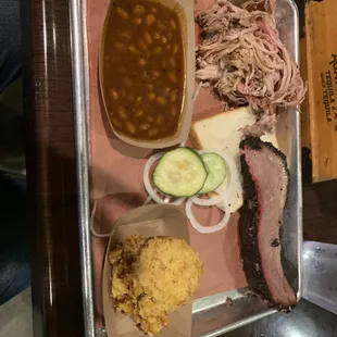 2 meat plate - pork and brisket. Baked beans, spoon bread, complimentary pickles and onions