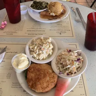 Salmon patty, macaroni salad, coleslaw, open face roast beef, mashed potatoes with gravy,  and kale,