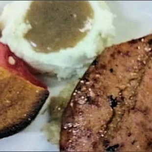 Kielbasa with kraut and mashed potatoes.