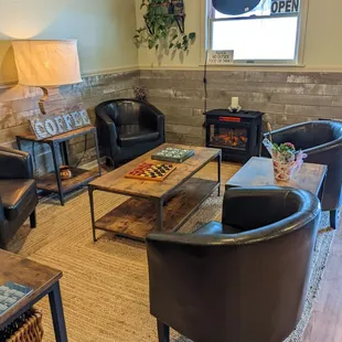 Cozy fireplace with board games to enjoy with your coffee