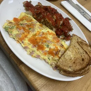 Western Omlet with home fries and rye toast.