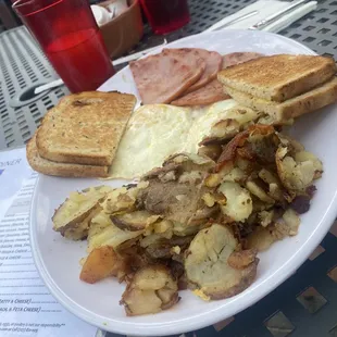 Fried eggs and ham and hash browns