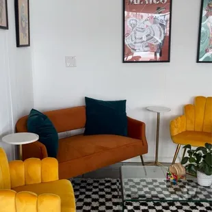 yellow chairs and a black and white checkered rug