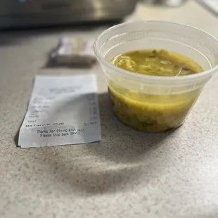 A little more than half full, chicken soup