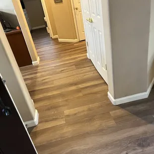 White baseboards pop in contrast to floor.