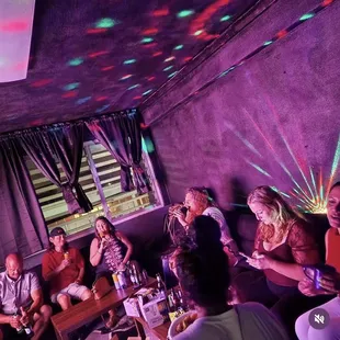 a group of people in a karaoke