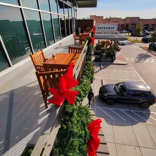 Public outdoor balcony, 6 tables, electric outlets behind each, but bring long cables.