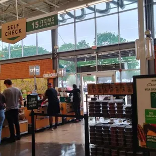 people shopping in a grocery store