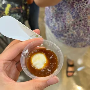 a person holding a cup of coffee