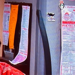 Your pizza flyer is on the refrigerator of The Big Bang Theory