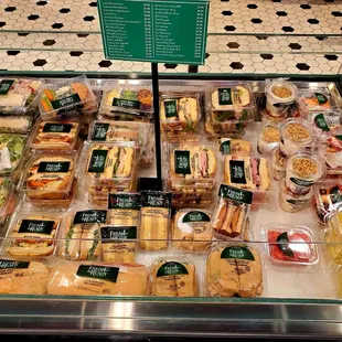 Assorted Sandwiches, Salads, Fruits/Veggie Snack Trays, and Yogurts.