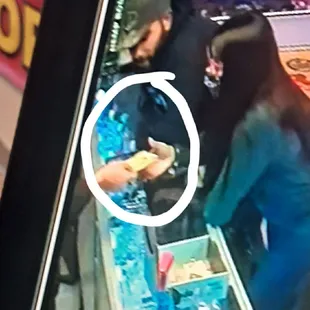 Yup .. thats definatly her hand grabbing my money for my dog which she did not find.  Manny says its him she was never present