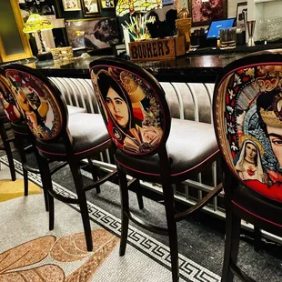 Famous people in the back of the chairs