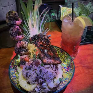 Thursday Night Caribbean Special...
Jerk seafood pineapple bowl. 
Salmon &amp; shrimp 
w. Coconut rice &amp; peas 
curry cabbage 
Peppers