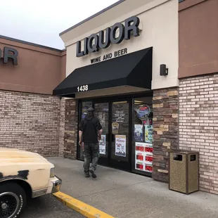 a man walking out of the door