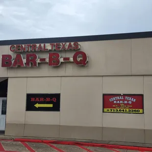 A view of the sign and front door.