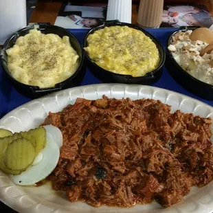 1 meat dinner plate comes with 2 sides.  Chopped beef,  mac and cheese, broccoli rice,  and banana pudding to share