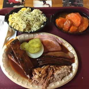 4 meat combo with 2 sides. Ribs, pulled pork, smoked ham, &amp; sliced beef. Sweet potatoes &amp; broccoli and cheese rice