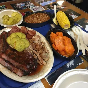 4 meat plate, sweet potatoes, baked beans, &amp; corn.