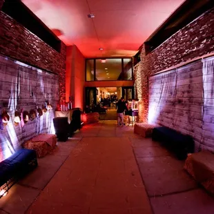 We transformed this hallway into a western theme with wood like walls, saloon bar and dance floor.