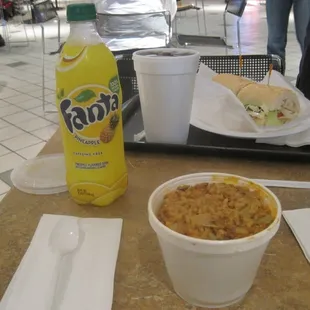 Foreground: large Jambalaya; Background: small Turkey Po&apos;Boy; middle: Pineapple Fanta
