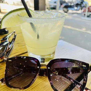 a margarita and sunglasses