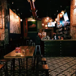 a man sitting at a bar in a restaurant